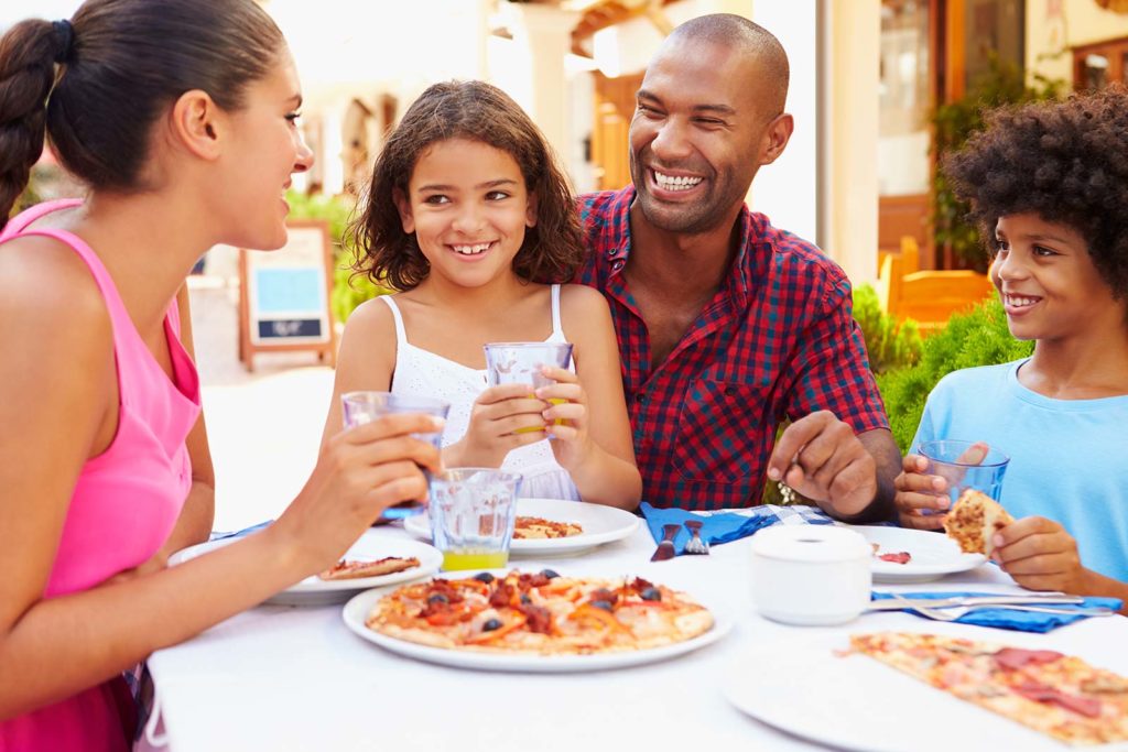 NATL_Pic_Dining_Restaurant_Outdoor_Patio_Family_Pizza_Stock_Shutterstock_236885488