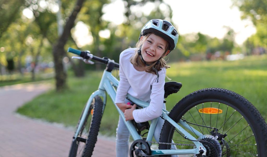 girl-on-bike-in-city-park