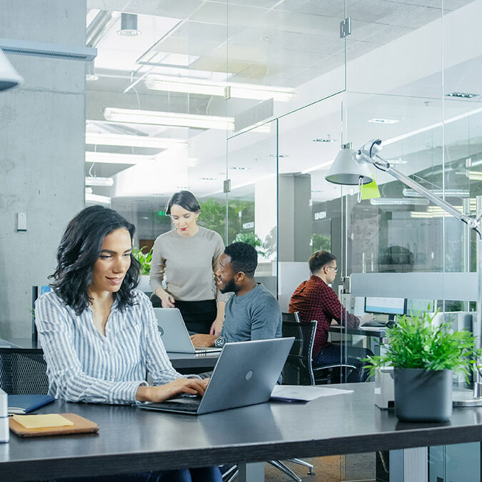 woman-at-office-desk-new-jobs-city-park
